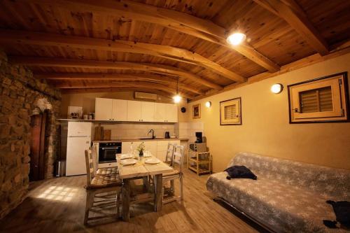 a living room with a table and a couch at Holiday home Raos - a special stonehouse, Brela in Brela