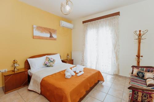 a bedroom with a bed with two stuffed animals on it at Happy Home in Kavála