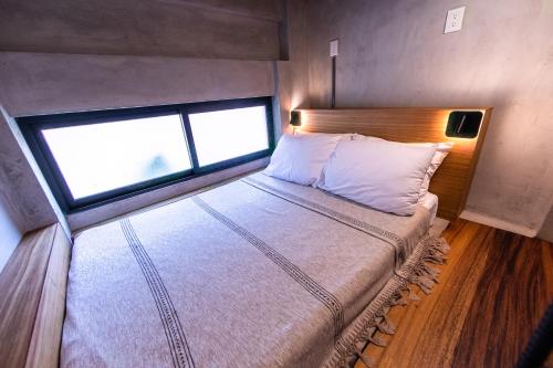 Una cama o camas en una habitación de Nectar Hotel, Cafe, Cowork - Adults Only