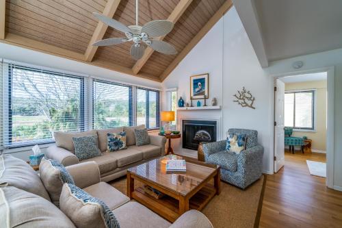 a living room with a couch and a table at 915 Sealoft Villa in Seabrook Island