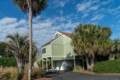 a house with palm trees in front of it at 915 Sealoft Villa in Seabrook Island