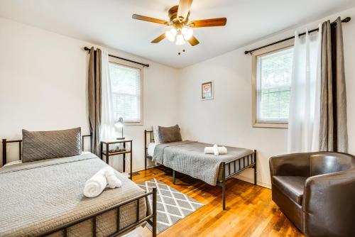 a bedroom with two beds and a ceiling fan at Atlanta Vacation Rental Less Than 10 Mi to Downtown! in Atlanta