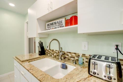 a kitchen with a sink and a toaster on a counter at Cozy Shenandoah Home Less Than 2 Mi to The Woodlands Mall! in The Woodlands