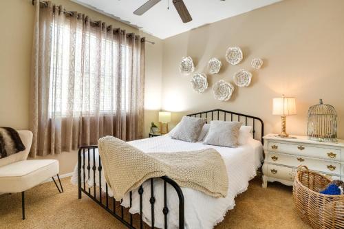 a bedroom with a bed and a chair and a window at Sunny V Arizona Retreat with Private Pool and Patio in Surprise