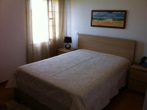 Katil atau katil-katil dalam bilik di Reguengos Hotel