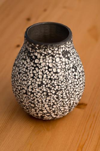 a black and white vase sitting on a table at Aerenia Luxury Suites in Karterados