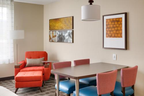 a dining room with a table and chairs at TownePlace Suites by Marriott Salt Lake City Draper in Draper