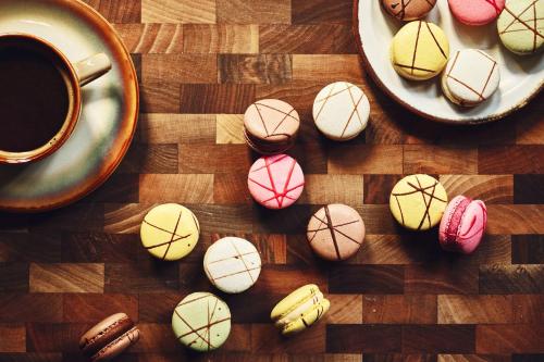 a group of cookies on a table with a cup of coffee at voco Osaka Central by IHG in Osaka
