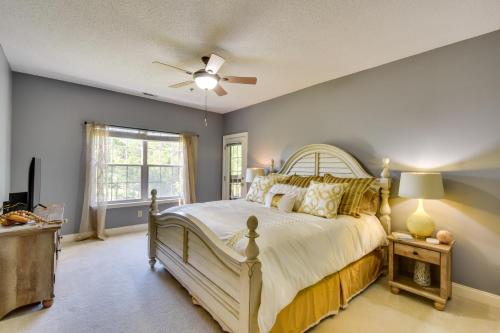 a bedroom with a large bed and a ceiling fan at Kingwood Resort Condo with Golf Course Views! in Clayton