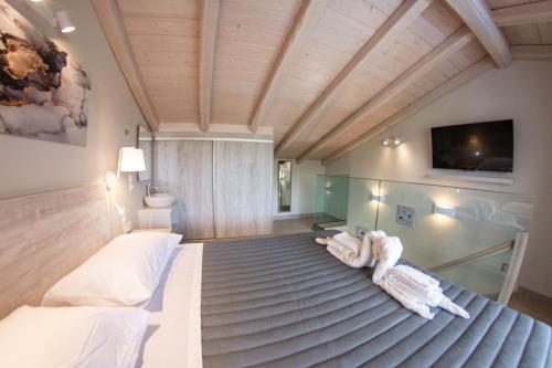 Postel nebo postele na pokoji v ubytování Jasmine Hotel & Apartments
