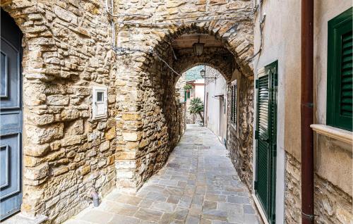 an alley in a stone building with an archway at Pet Friendly Home In Montecorice in Montecorice