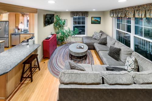 a living room with a couch and a table at Top Notch Inn in Gorham