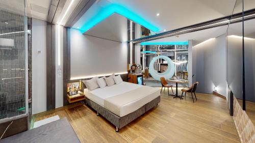 a bedroom with a bed and a blue lighting at Motel DUBAI BH in Belo Horizonte