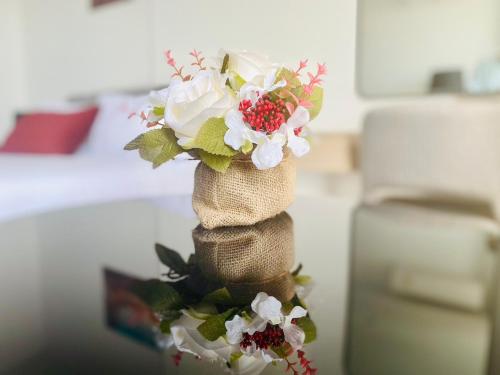 a bouquet of flowers in a bag on a table at Edge Central Pattaya Vip Condo in Pattaya Central