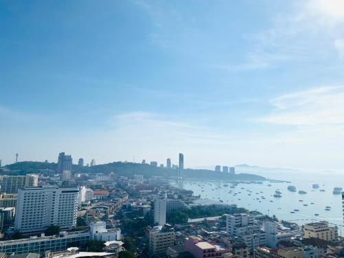 a city with a view of the water and buildings at Edge Central Pattaya Vip Condo in Pattaya Central