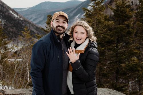 a man and woman posing for a picture in the mountains at The Wentworth in Jackson