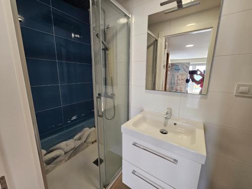 a bathroom with a sink and a shower at Casa del Mar in Almería