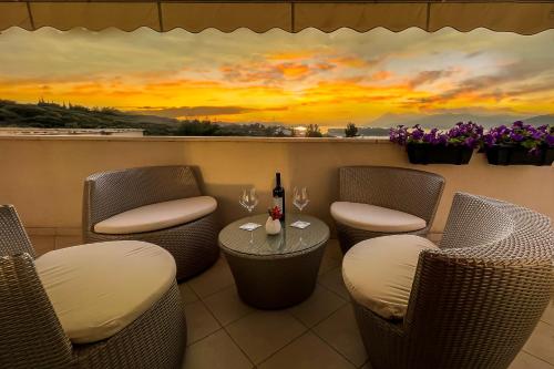 a restaurant with a sunset mural on the wall at Magic Sunset Suite in Dubrovnik
