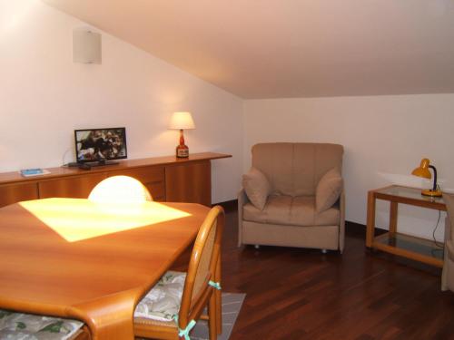 a living room with a chair and a table at Greatview Narni in Narni