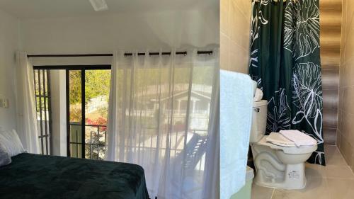 a bedroom with a bed and a toilet and a window at Loma Alta Hotel Boutique in Polo