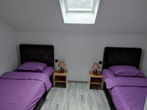 Postel nebo postele na pokoji v ubytování Bella apartman