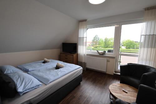 Postel nebo postele na pokoji v ubytování Haus Ausreißer 2 - Ankerplatz