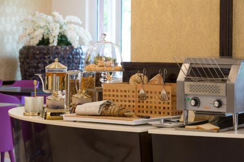 a table with baskets and a sewing machine on it at Hotel Du Nord in Interlaken