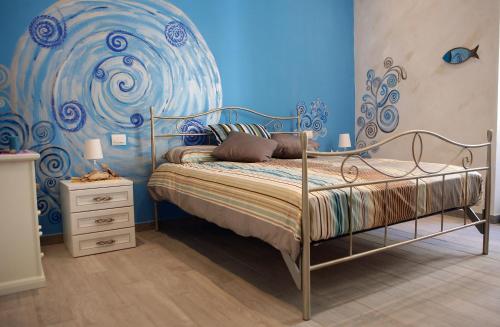 Un pat sau paturi într-o cameră la Affittacamere La Risacca