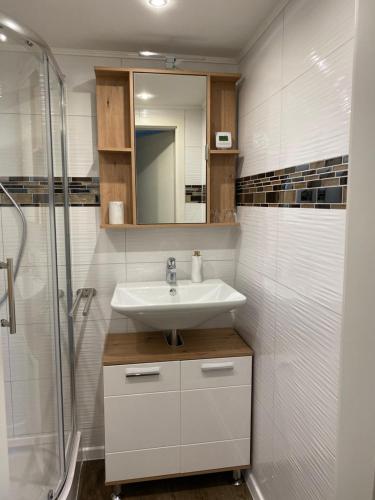 a bathroom with a sink and a shower at Apartment an der Mosel 2 in Graach