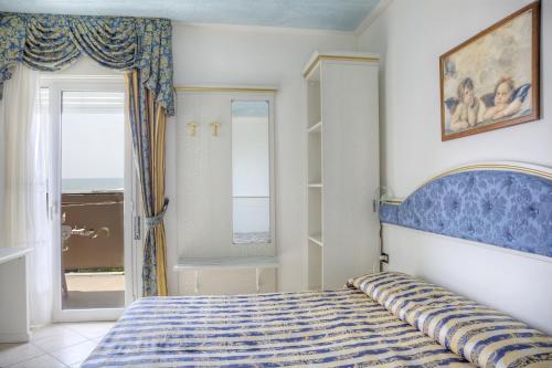 Postel nebo postele na pokoji v ubytování Hotel Elpiro