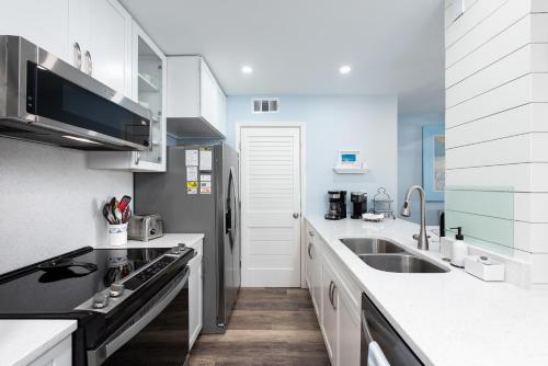 a kitchen with a sink and a counter top at 1305 Pelican Watch Villa in Seabrook Island