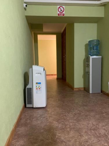 an empty room with two refrigerators and a refrigerator at Mega city in Kyiv