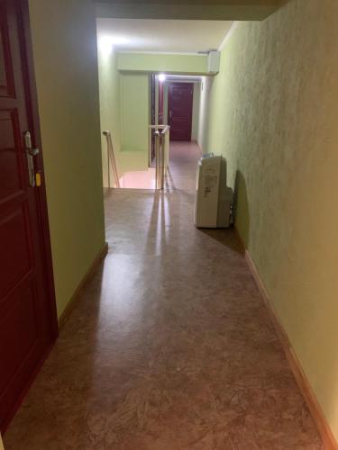 a hallway with a room with a toaster sitting on the floor at Mega city in Kyiv