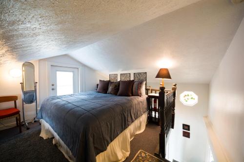 a bedroom with a large bed in a attic at Lake House in Nashville