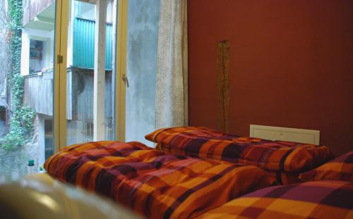 Ein Bett oder Betten in einem Zimmer der Unterkunft Hostel Tabakhuesli