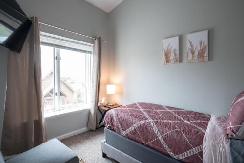 a bedroom with a bed and a window at Girlfriend Getaway Suite in Nashville