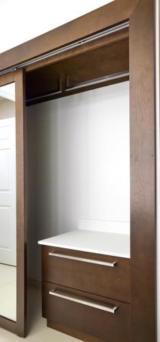 a closet with wooden cabinets and a white counter top at Residence Inn Eugene Springfield in Eugene