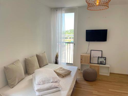 Postel nebo postele na pokoji v ubytování Urban Oasis: Stylische Wohnung