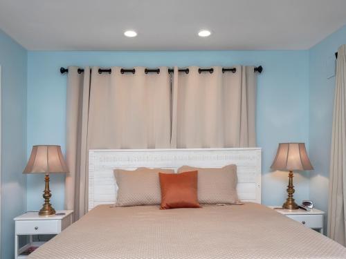 a bedroom with a large bed with two lamps at 2631 Seabrook Island Road in Seabrook Island