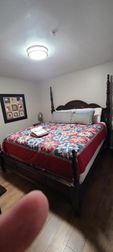 a bedroom with a bed with a quilt on it at Captain's Quarters Riverfront #2 in Nashville