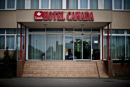 a hotel canada building with steps in front of it at Canada Hotel Budapest in Budapest