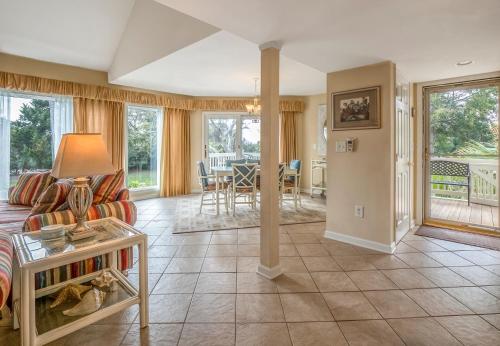 a living room with a couch and a table at 724 Spinnaker Beach Villa in Seabrook Island