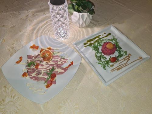 two plates of food sitting on a table at The Life in Marcellina