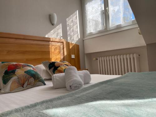 Ένα ή περισσότερα κρεβάτια σε δωμάτιο στο Le Relais De La Place