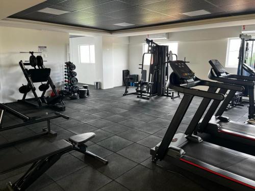 a gym with several tread machines in a room at Studio no West Fit Mossoró Alto Padrão in Mossoró