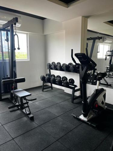 a gym with several tread machines in a room at Studio no West Fit Mossoró Nova Betania in Mossoró