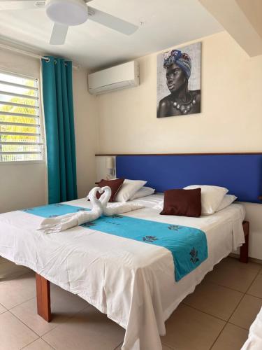 Postel nebo postele na pokoji v ubytování Hôtel DOUCE VAGUE