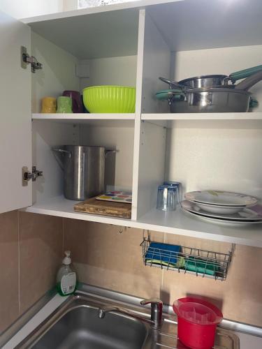 a kitchen with a sink and some pots and pans at Court Inn in Galliate