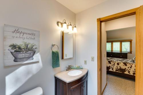 a bathroom with a sink and a mirror at Family-Friendly Galena Rental Golf Course Access! in Galena