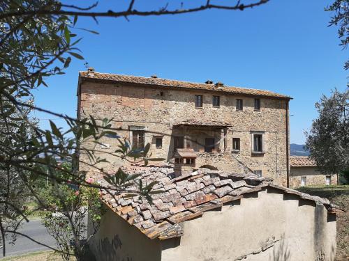 an old stone building on top of a house at Casa Zeno in Volterra